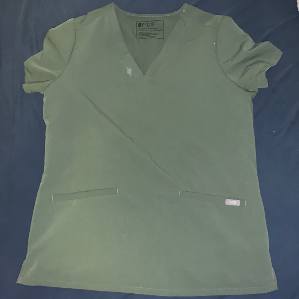 Figs scrub top with small make up stain. :/ But still very functional.